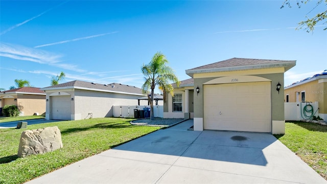 2330 28th Ave E, Palmetto, FL 34221 - ranch-style home featuring concrete driveway, stucco siding, a front lawn, and a garage