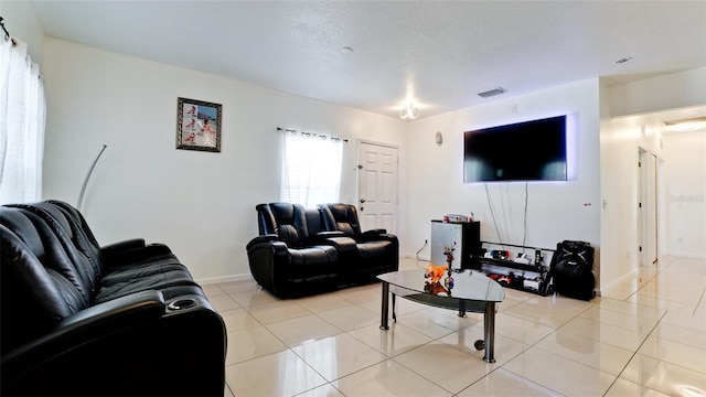 2330 28th Ave E, Palmetto, FL 34221 - living area featuring light tile patterned floors and baseboards