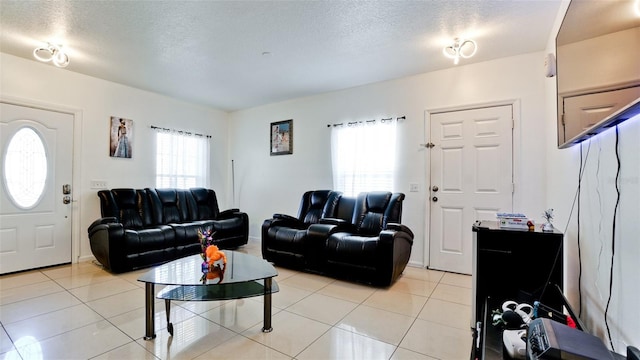2330 28th Ave E, Palmetto, FL 34221 - living area with plenty of natural light, light tile patterned floors, and a textured ceiling
