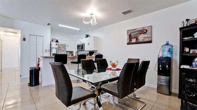 2330 28th Ave E, Palmetto, FL 34221 - dining space featuring light tile patterned flooring and baseboards