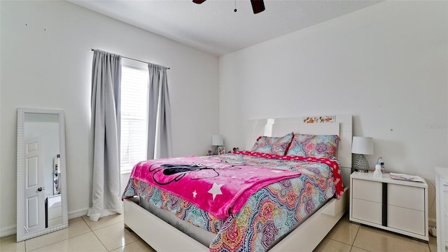 2330 28th Ave E, Palmetto, FL 34221 - bedroom with light tile patterned floors, ceiling fan, and baseboards