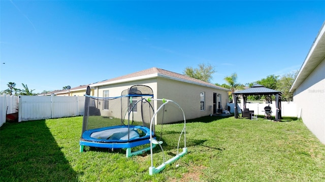2330 28th Ave E, Palmetto, FL 34221 - view of yard featuring a gazebo and a trampoline
