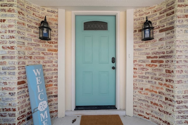 7202 18th Ave NW, Bradenton, FL 34209 - doorway to property featuring brick siding and a porch