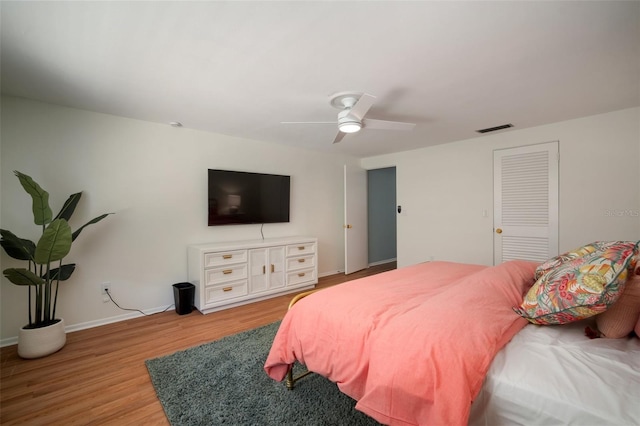7202 18th Ave NW, Bradenton, FL 34209 - bedroom with wood finished floors, baseboards, and a ceiling fan