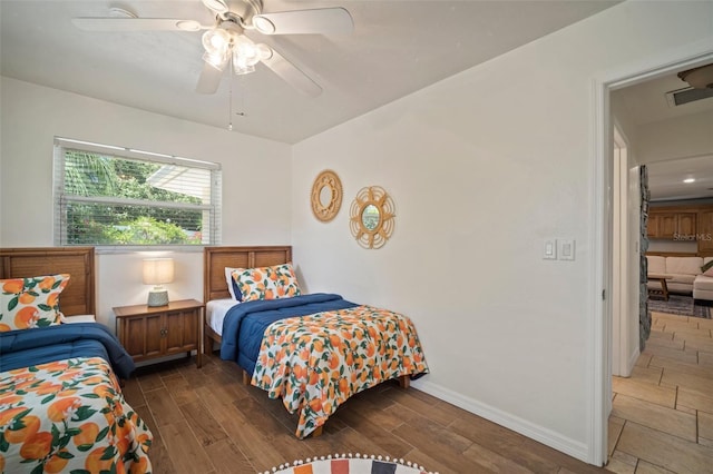 7202 18th Ave NW, Bradenton, FL 34209 - bedroom with wood finished floors, baseboards, and a ceiling fan