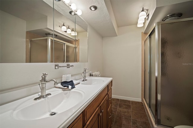 7202 18th Ave NW, Bradenton, FL 34209 - full bathroom with double vanity, a stall shower, and baseboards