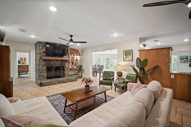 7202 18th Ave NW, Bradenton, FL 34209 - living area with a ceiling fan, stone tile floors, a stone fireplace, and recessed lighting