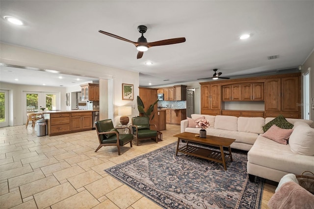 7202 18th Ave NW, Bradenton, FL 34209 - living room featuring ceiling fan, recessed lighting, and light stone finish flooring