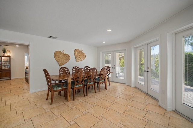 7202 18th Ave NW, Bradenton, FL 34209 - dining area featuring french doors, recessed lighting, light stone finish flooring, and baseboards