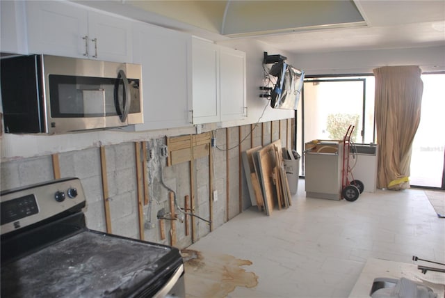 4621 Gulf Of Mexico Dr Unit 2F, Longboat Key, FL 34228 - kitchen with stainless steel appliances and white cabinets