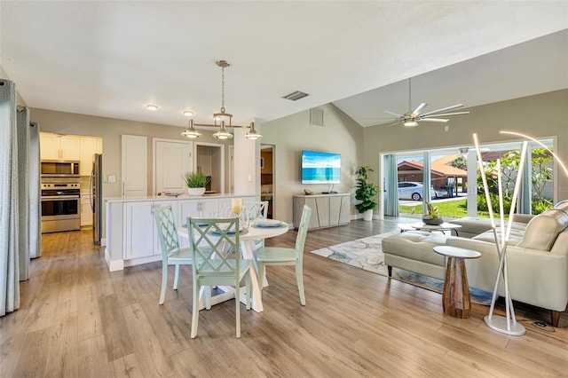 6462 Draw Ln Unit 72, Sarasota, FL 34238 - dining room featuring light wood-style flooring, lofted ceiling, and ceiling fan