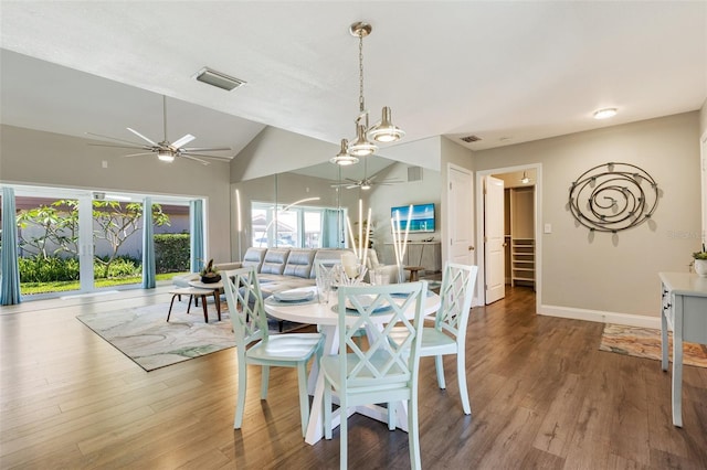 6462 Draw Ln Unit 72, Sarasota, FL 34238 - dining area featuring a ceiling fan, plenty of natural light, wood finished floors, vaulted ceiling, and baseboards