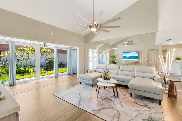 6462 Draw Ln Unit 72, Sarasota, FL 34238 - living room with high vaulted ceiling, ceiling fan, and wood finished floors
