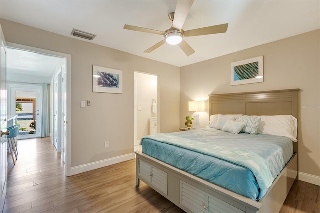 6462 Draw Ln Unit 72, Sarasota, FL 34238 - bedroom featuring baseboards, light wood-type flooring, a ceiling fan, and connected bathroom