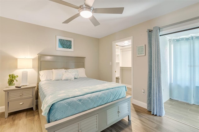 6462 Draw Ln Unit 72, Sarasota, FL 34238 - bedroom with wood finished floors, baseboards, a ceiling fan, and a spacious closet