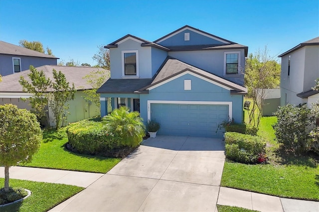 5033 Brickwood Rise Dr, Wimauma, FL 33598 - traditional-style home featuring driveway, stucco siding, a front lawn, and roof with shingles