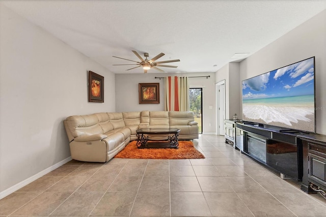 5033 Brickwood Rise Dr, Wimauma, FL 33598 - living area with ceiling fan, tile patterned floors, and baseboards