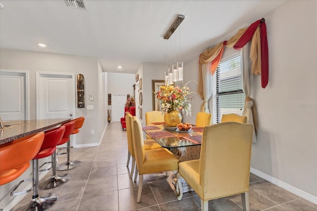 5033 Brickwood Rise Dr, Wimauma, FL 33598 - tiled dining room featuring baseboards and recessed lighting