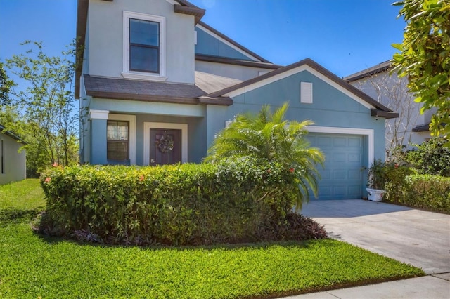 5033 Brickwood Rise Dr, Wimauma, FL 33598 - view of front of home featuring concrete driveway, an attached garage, stucco siding, and a front lawn