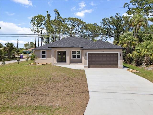 2704 Gaspar Ave, North Port, FL 34288 - view of front of property with stucco siding, a front lawn, an attached garage, concrete driveway, and a shingled roof