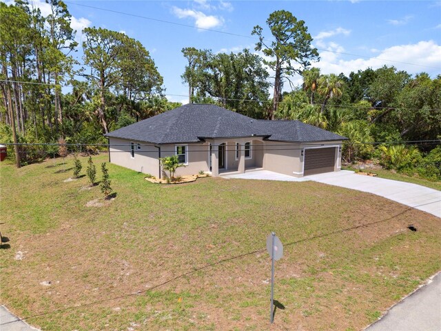 2704 Gaspar Ave, North Port, FL 34288 - view of front facade with a garage, driveway, stucco siding, and roof with shingles