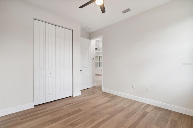2704 Gaspar Ave, North Port, FL 34288 - unfurnished bedroom with light wood finished floors, a closet, baseboards, and ceiling fan