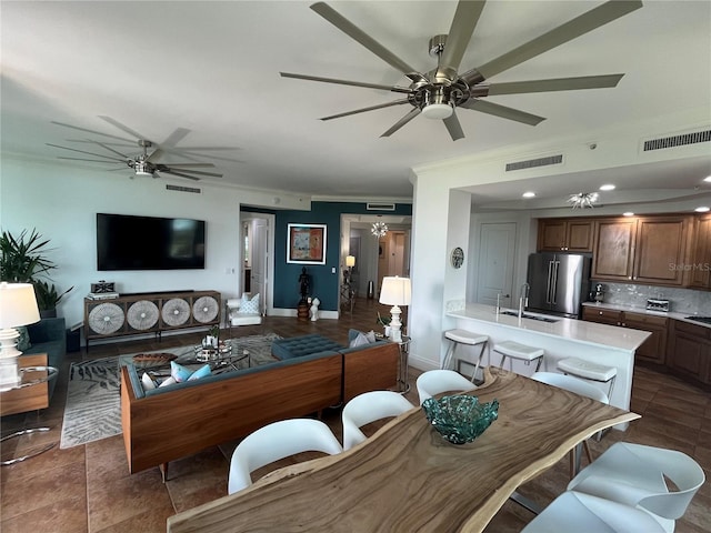 130 Riviera Dunes Way Unit 304, Palmetto, FL 34221 - living area featuring a ceiling fan, crown molding, and recessed lighting