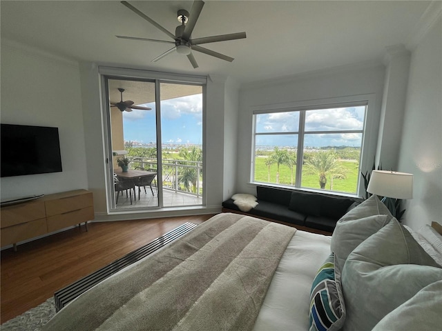 130 Riviera Dunes Way Unit 304, Palmetto, FL 34221 - bedroom with ornamental molding, access to outside, wood finished floors, and ceiling fan