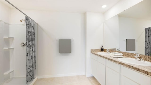 12036 Lansing Gln, Parrish, FL 34219 - full bathroom featuring a shower, double vanity, tile patterned flooring, baseboards, and recessed lighting