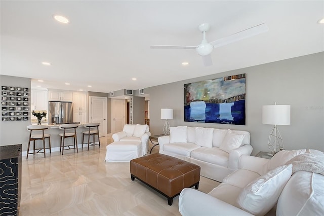 living area with recessed lighting and ceiling fan