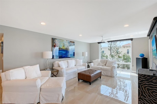 living room featuring recessed lighting and a ceiling fan