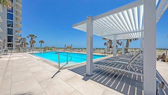 2425 Gulf Of Mexico Dr Unit 6A, Longboat Key, FL 34228 - community pool featuring a patio and fence