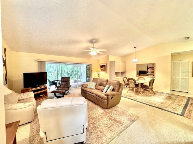 5804 Garden Lakes Fern, Bradenton, FL 34203 - living room with carpet, lofted ceiling, a textured ceiling, and ceiling fan