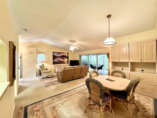5804 Garden Lakes Fern, Bradenton, FL 34203 - dining space featuring a textured ceiling, a ceiling fan, vaulted ceiling, plenty of natural light, and light carpet