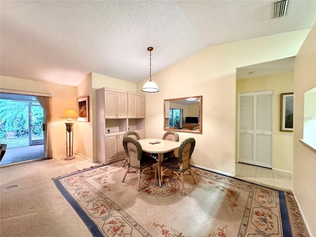 5804 Garden Lakes Fern, Bradenton, FL 34203 - dining area with vaulted ceiling, baseboards, and a textured ceiling