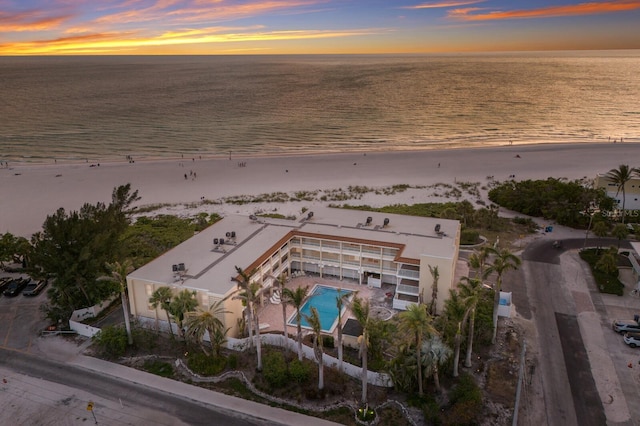 aerial overview of property's location with extended coastline and a pool area