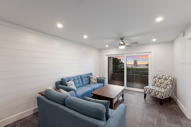 living area featuring recessed lighting, ceiling fan, and baseboards