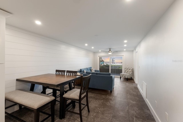 dining room featuring recessed lighting, ceiling fan, dark stone finish flooring, and baseboards