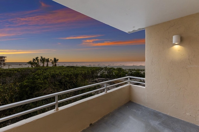 balcony at dusk with a water view