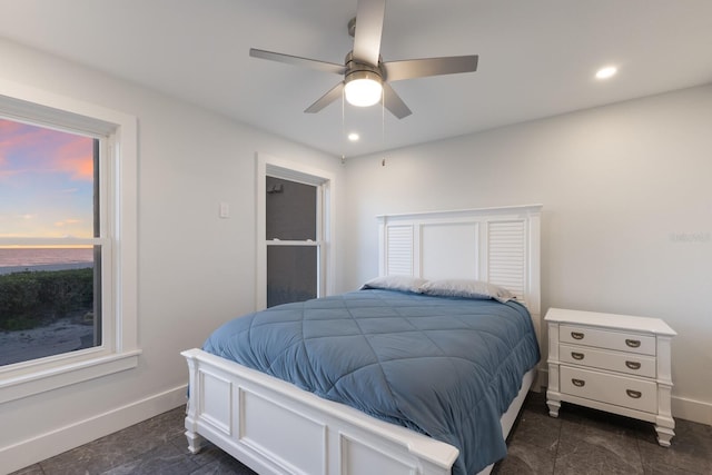 bedroom with baseboards, a ceiling fan, and recessed lighting