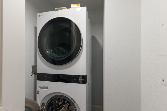 washroom with stacked washer / dryer