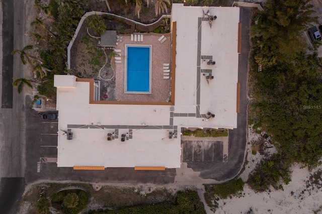 view of property location with a pool area