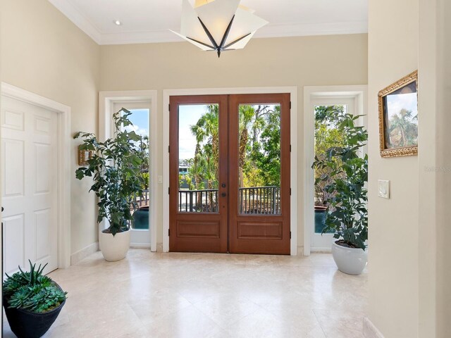 7320 Melaleuca Way, Siesta Key, FL 34242 - entrance foyer featuring french doors, ornamental molding, baseboards, and light tile patterned flooring