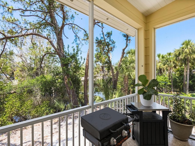 7320 Melaleuca Way, Siesta Key, FL 34242 - sunroom / solarium with view of wooded area