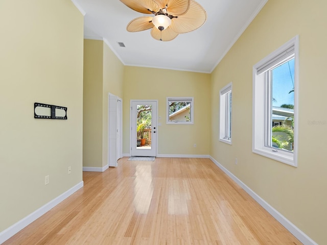 7320 Melaleuca Way, Siesta Key, FL 34242 - unfurnished room with ornamental molding, a ceiling fan, light wood-type flooring, and baseboards