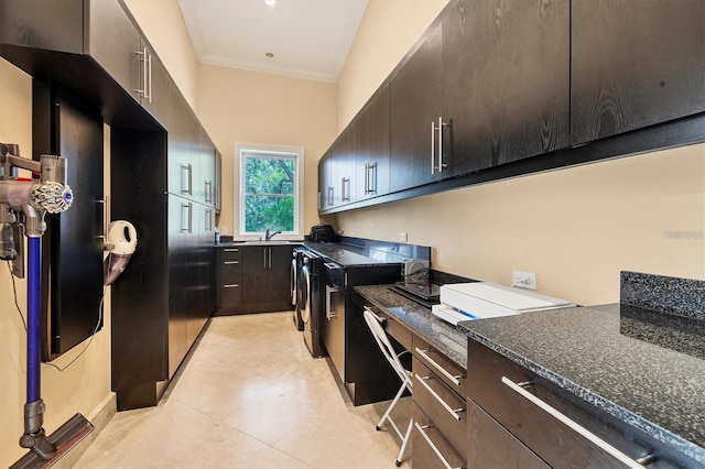 7320 Melaleuca Way, Siesta Key, FL 34242 - washroom featuring light tile patterned floors, washing machine and dryer, crown molding, and a sink
