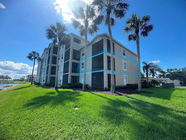 7911 Grand Estuary Trl Unit 201, Bradenton, FL 34212 - view of building exterior with a water view