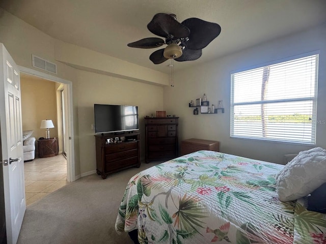 7911 Grand Estuary Trl Unit 201, Bradenton, FL 34212 - tiled bedroom with carpet flooring, ceiling fan, and baseboards