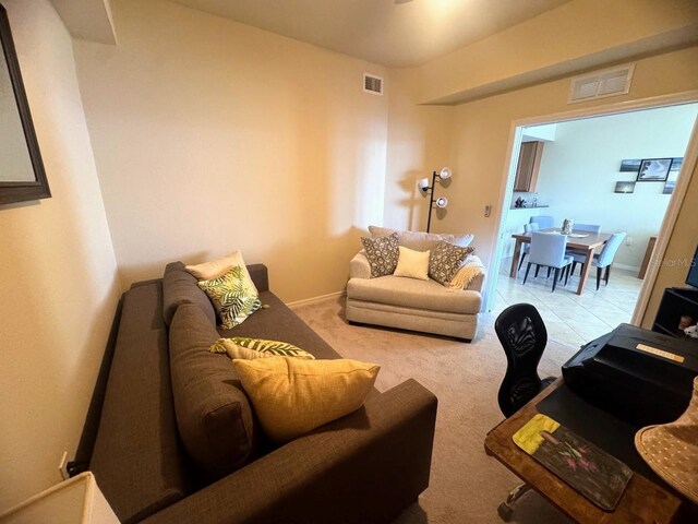 7911 Grand Estuary Trl Unit 201, Bradenton, FL 34212 - living room featuring carpet floors