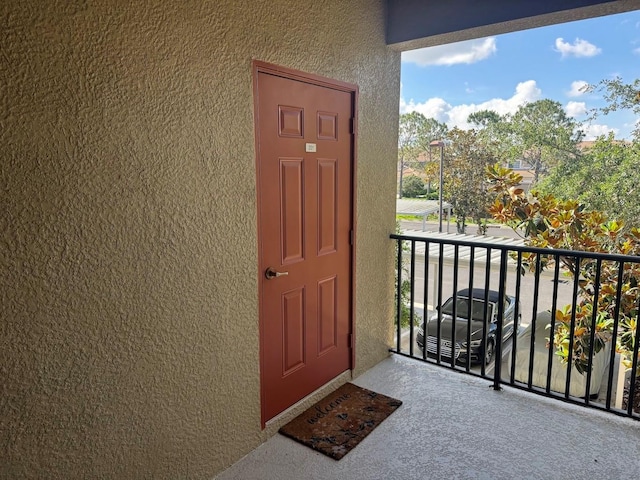 7911 Grand Estuary Trl Unit 201, Bradenton, FL 34212 - entrance to property with stucco siding and a balcony